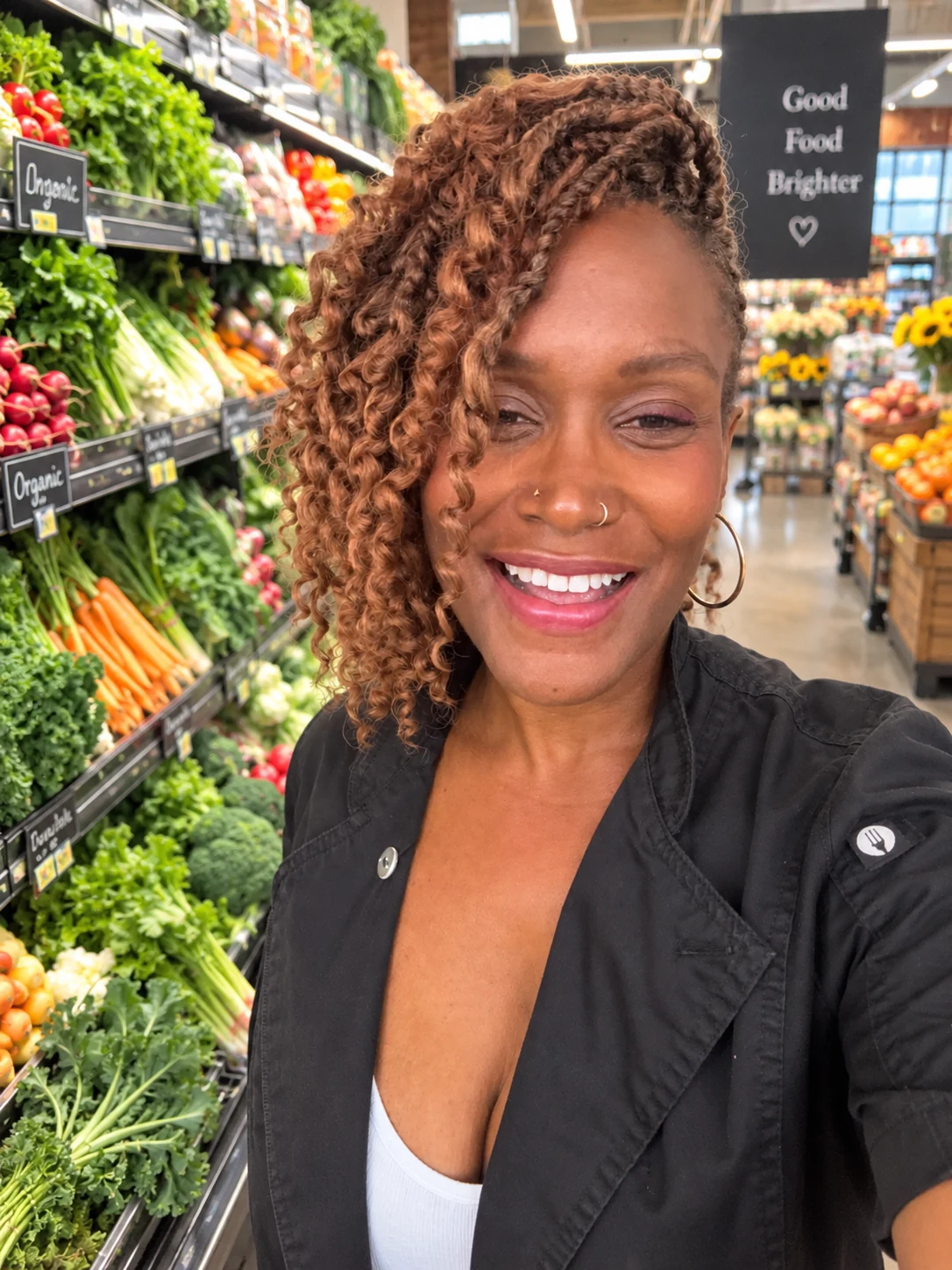 Ebeth smiling in the produce aisle